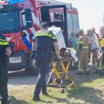 Man met scootmobiel te water aan Koning Willem-Alexander Boulevard in Maassluis